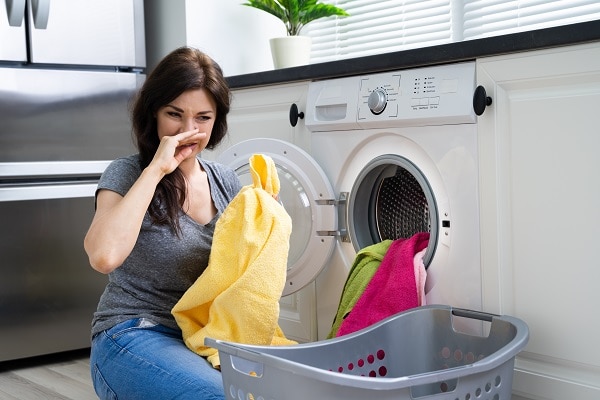 why does my washer stink